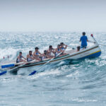 a raft boat with full of paddlers. Leadership example